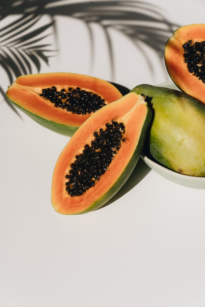 fresh ripe papaya on white table